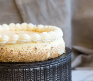 The Mad Hatter's NY Style Cheesecake on an ornate serving dish.