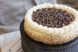 The Mad Hatter's Turtle Cheesecake topped with poured caramel and toasted pecans.