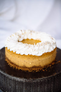 The Mad Hatter's Pumpkin Cheesecake topped with whipped cream.