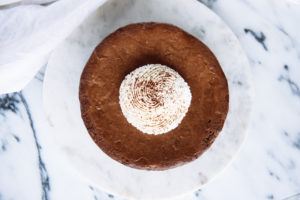 The Mad Hatter's Chocolate Cheesecake topped with whipped cream.
