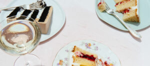 assorted gourmet cakes paired with wine at Mad Hatter Cafe & Bakeshop, perfect for Durham's upscale events and celebrations