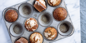 Freshly baked muffins from Mad Hatter's Durham Bakery in a muffin tin