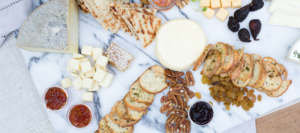 Assorted cheese board with nuts and crackers from Mad Hatter's catering in Durham